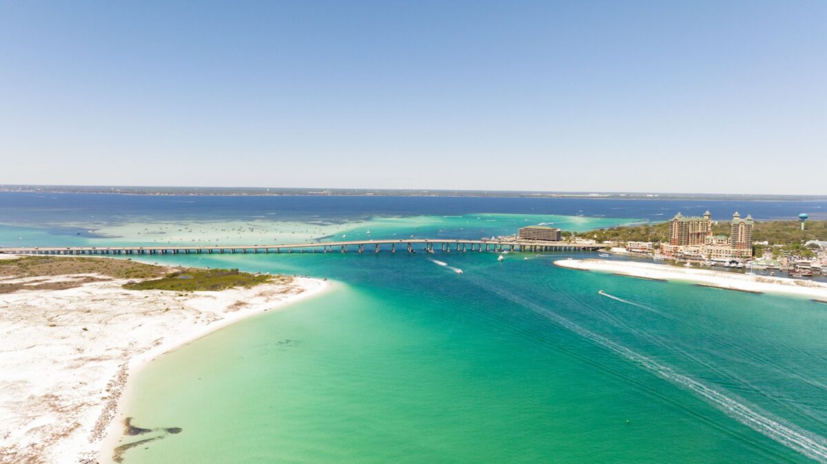 A drone shot of the sand and water in Destin, Florida